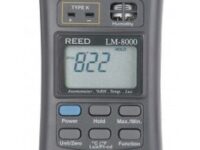 A close up of an electronic device with the time and date displayed.