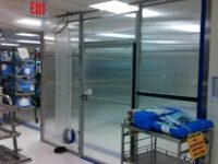 A room with glass doors and shelves in it