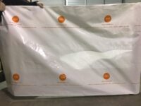 A white sheet with orange circles on it.