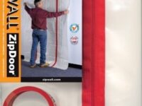 A man standing in front of a red curtain.