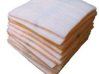 A stack of white and orange paper towels.