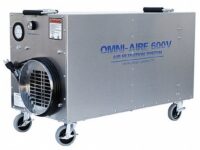 A large industrial air cleaner with wheels and handles.