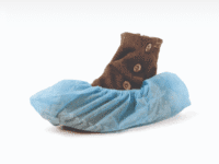 A brown boot in blue shoe cover on white background.